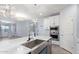 Kitchen features a large island with a stainless steel sink, a breakfast bar, and pendant lighting at 18637 W Williams Rd, Surprise, AZ 85387