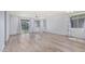 The living room has lots of natural light, luxury vinyl flooring, and access to the backyard at 18637 W Williams Rd, Surprise, AZ 85387