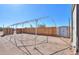 This backyard boasts a spacious lot, privacy fence and storage shed at 192 S Ralston Rd, Maricopa, AZ 85139