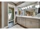 Modern bathroom with double vanity sinks and frameless glass shower at 2110 W Navarro Ave, Mesa, AZ 85202