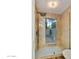 Luxurious bathroom featuring a glass shower enclosure and a tiled wall at 2110 W Navarro Ave, Mesa, AZ 85202