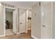 Bright hallway with neutral walls, leading to the laundry room and other rooms at 2110 W Navarro Ave, Mesa, AZ 85202