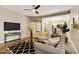 Comfortable living room with sleek furnishings, open layout, and hardwood flooring at 2110 W Navarro Ave, Mesa, AZ 85202