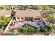 Aerial view of backyard featuring a private pool, built-in grill, and fire pit seating area at 22204 N 55Th St, Phoenix, AZ 85054
