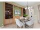 Dining room with light wood furniture and built-in cabinets providing ample storage and style at 22204 N 55Th St, Phoenix, AZ 85054