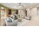 Spacious living area with a neutral color palette, comfortable seating, and tiled floors at 22204 N 55Th St, Phoenix, AZ 85054