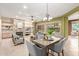 Inviting open-concept living room with a stone fireplace, built-in shelves, and stylish dining area at 22204 N 55Th St, Phoenix, AZ 85054