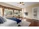 Bright main bedroom features large windows, a sitting area, and dark hardwood floors at 22204 N 55Th St, Phoenix, AZ 85054