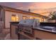 Outdoor kitchen featuring a built-in grill and counter space for outdoor dining at 22204 N 55Th St, Phoenix, AZ 85054