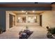Covered patio offers a peaceful retreat with desert landscaping and stone accents at 22204 N 55Th St, Phoenix, AZ 85054