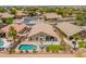 This is an aerial view of a beautiful home showing a private backyard pool, patio, and lush landscaping at 22625 N Van Loo Dr, Maricopa, AZ 85138