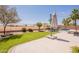 Beautiful backyard featuring a patio area, well manicured lawn, mature trees, and an outdoor seating area at 22625 N Van Loo Dr, Maricopa, AZ 85138