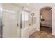 Bathroom featuring a soaking tub, separate shower, and view into the main bedroom at 22625 N Van Loo Dr, Maricopa, AZ 85138
