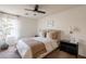 Comfortable bedroom featuring a ceiling fan, a stylish headboard, and neutral décor for a relaxing ambiance at 22625 N Van Loo Dr, Maricopa, AZ 85138