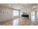 Bright dining area with wainscoting, tile floors, and seamless transition to the living spaces at 22625 N Van Loo Dr, Maricopa, AZ 85138