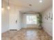 Inviting entryway featuring tile flooring, decorative lighting, and a view to the exterior at 22625 N Van Loo Dr, Maricopa, AZ 85138