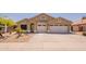 Charming single-story home featuring a two-car garage and well-maintained desert landscaping at 22625 N Van Loo Dr, Maricopa, AZ 85138