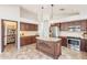 Gourmet kitchen featuring stainless appliances, custom cabinets, and a pantry at 22625 N Van Loo Dr, Maricopa, AZ 85138