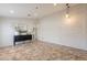 Spacious living room with tile floors, decorative millwork, and designer lighting fixtures at 22625 N Van Loo Dr, Maricopa, AZ 85138