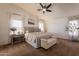Serene main bedroom featuring carpet, vaulted ceilings, and neutral décor at 22625 N Van Loo Dr, Maricopa, AZ 85138