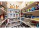 Walk-in pantry with ample shelving for organized storage at 22625 N Van Loo Dr, Maricopa, AZ 85138