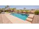 Refreshing swimming pool with a spacious sun deck, surrounded by lush landscaping and desert scenery at 22625 N Van Loo Dr, Maricopa, AZ 85138