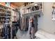 Walk-in closet with extensive shelving and hanging space for clothing and accessories at 22625 N Van Loo Dr, Maricopa, AZ 85138