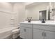 A modern bathroom with a double sink vanity, white cabinetry, and a shower-tub combination at 22913 N 183Rd Dr, Surprise, AZ 85387