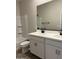 Well-lit bathroom featuring a double vanity, modern fixtures, and a bathtub with shower at 22913 N 183Rd Dr, Surprise, AZ 85387