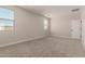Spacious bedroom with neutral carpet and multiple windows allowing for great natural light at 22913 N 183Rd Dr, Surprise, AZ 85387