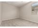A bright and airy empty bedroom with a window, ready for customization at 22913 N 183Rd Dr, Surprise, AZ 85387