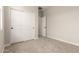 A bedroom showcasing ample closet space with white sliding doors, offering practical storage solutions at 22913 N 183Rd Dr, Surprise, AZ 85387