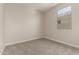 A cozy, empty bedroom bathed in natural light from a window, ready for personalization and relaxation at 22913 N 183Rd Dr, Surprise, AZ 85387