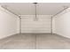 A spacious two-car garage offers ample room for vehicles and storage with an automatic door at 22913 N 183Rd Dr, Surprise, AZ 85387