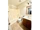 Bathroom featuring a shower-tub combo, single sink vanity, and tile flooring at 23284 W Pima St, Buckeye, AZ 85326