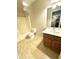 Bathroom featuring a shower-tub combo, single sink vanity, and tile flooring at 23284 W Pima St, Buckeye, AZ 85326