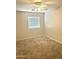 Bedroom with carpet, a ceiling fan, and a window that allows ample natural light at 23284 W Pima St, Buckeye, AZ 85326