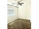 Bedroom with carpet, a ceiling fan, and a window that allows ample natural light at 23284 W Pima St, Buckeye, AZ 85326