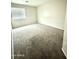 Bright bedroom with neutral walls and plush carpeting, perfect for relaxation at 23284 W Pima St, Buckeye, AZ 85326