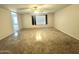 This expansive main bedroom features neutral walls, a ceiling fan, and great natural light at 23284 W Pima St, Buckeye, AZ 85326