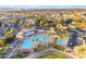 Overhead view of the stunning community pool and recreation area near a golf course and neighborhood at 23753 S Vacation Way, Sun Lakes, AZ 85248