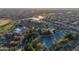 This aerial showcases community amenities including tennis courts, pool, and lush landscaping at 23753 S Vacation Way, Sun Lakes, AZ 85248
