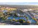 Aerial shot features community with golf course, tennis courts, community pool, and nearby shopping at 23753 S Vacation Way, Sun Lakes, AZ 85248