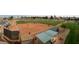 Aerial view of a community ball field with players in action on a bright day at 23753 S Vacation Way, Sun Lakes, AZ 85248
