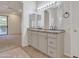 Bathroom featuring double sinks with granite counters, ceiling fan, and tile floors at 23753 S Vacation Way, Sun Lakes, AZ 85248