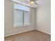 Bedroom features tile floor, ceiling fan, large window and natural light at 23753 S Vacation Way, Sun Lakes, AZ 85248