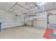 Spacious garage features built-in shelving and storage with high ceilings at 23753 S Vacation Way, Sun Lakes, AZ 85248