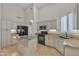 Spacious kitchen with a tile floor, kitchen island and shuttered windows at 23753 S Vacation Way, Sun Lakes, AZ 85248