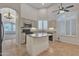 Full kitchen view with a kitchen island, shuttered windows and stainless steel appliances at 23753 S Vacation Way, Sun Lakes, AZ 85248