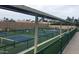 Active pickleball courts with covered spectator seating in a well-maintained community at 23753 S Vacation Way, Sun Lakes, AZ 85248